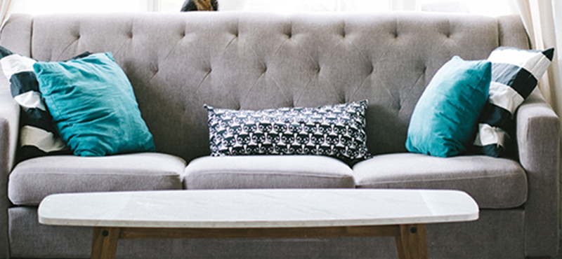 Grey sofa in a bright room.